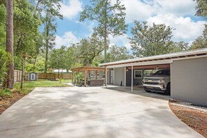 Property grounds - The Canopy on 10th | Game Room • Pets • Pergola (Gainesville)