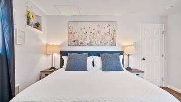 1 bedroom, desk, iron/ironing board, travel crib