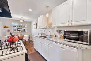 Fridge, microwave, oven, stovetop - Spacious Retreat with Hot Tub, Patio, & King Bed (Olympia)