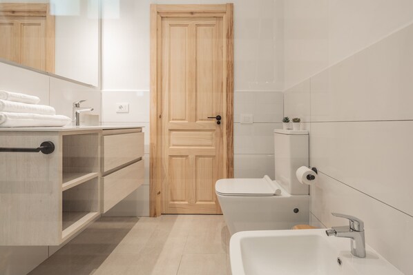 Shower, eco-friendly toiletries, hair dryer, bidet