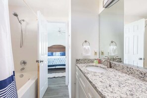 Shower, hair dryer, towels, shampoo