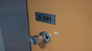 A door with a label reading "A 501" and a keyhole.