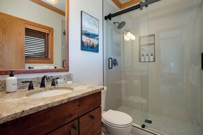 Shower, hair dryer, towels, shampoo