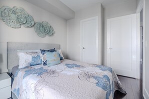 1 bedroom, desk, iron/ironing board, travel crib