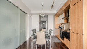 A modern kitchen with wooden cabinets and a built-in oven. - GLOBALSTAY. High Floor 1 Br in the Heart of DT (Toronto/Canada)