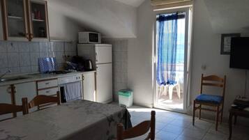 Apartment (Two Bedroom Apartment with Sea View a) | Private kitchen | Fridge