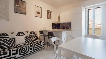 Comfort Duplex, Balcony | Living area | Flat-screen TV