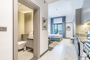 In-room safe, iron/ironing board, free WiFi, bed sheets - Comfortable Studio at MAG 930, Mohammad Bin Rashid City by Deluxe Holiday Homes (Dubai)