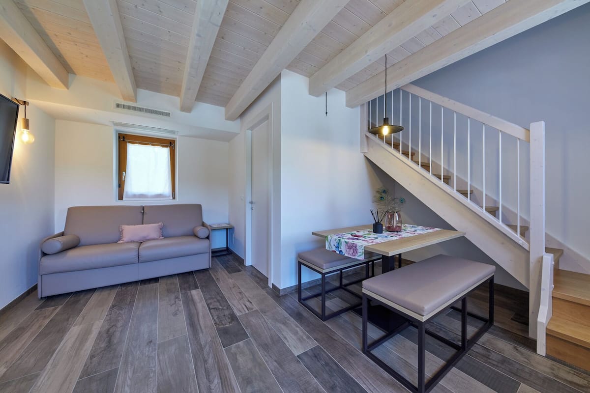Deluxe Duplex, 1 Bedroom | Living area | 32-inch Smart TV with digital channels, Netflix, streaming services