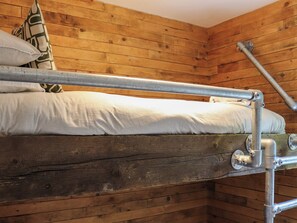 A bunk bed with metal railings and a wooden headboard. - Gwynant Lodge - UK47608 (Caernarfon)