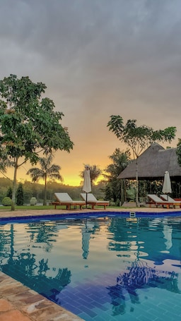 Outdoor pool, open 5:30 AM to midnight, pool umbrellas