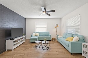 TV, fireplace - Sunny Palmetto Oasis: 4BR Home with Private Pool by RedAwning (Palmetto)