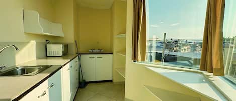 Microwave, coffee/tea maker, cookware/dishes/utensils