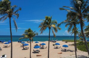 On the beach, sun-loungers, beach towels