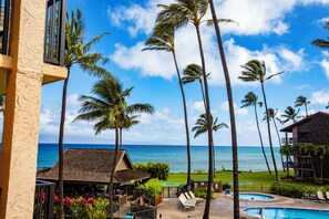 A resort with a pool, palm trees, and a view of the ocean. - KBM Resorts: Papakea Pke-304 Renovated Studio With Ocean Views! (Kaanapali)