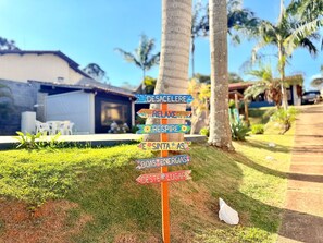 A signpost with multiple directional arrows pointing to different destinations.