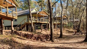 A cabin with a wooden deck and a covered porch. - Paddlewhack Cabin 5-The Bow (Jefferson)