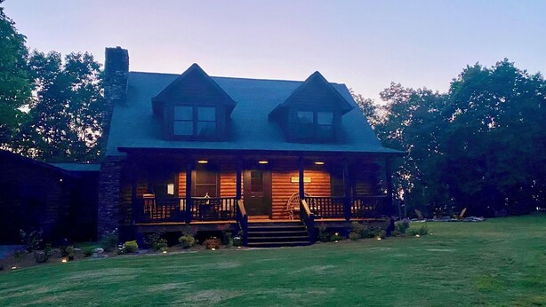 A log cabin with a porch and two chimneys, surrounded by a grassy yard. - Chase N' Sunsets - NEW Listing, Brow view, between Mentone & Little River Canyon (Fort Payne)