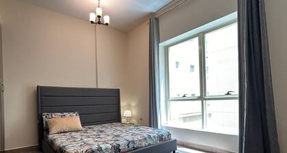 Cozy 2-bedroom apartment in charming Sharjah with AC