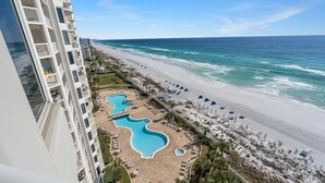 A high-rise hotel with a pool area, beach access, and ocean views. - Silver Beach Towers West 1105 | Destin | Beachfront, Outdoor Pool | My Beach Getaways (Destin)