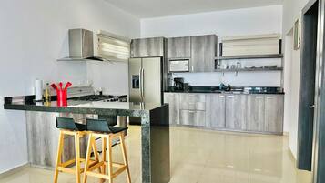 Fridge, microwave, stovetop, coffee/tea maker