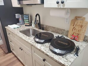 Fridge, microwave, stovetop, coffee/tea maker