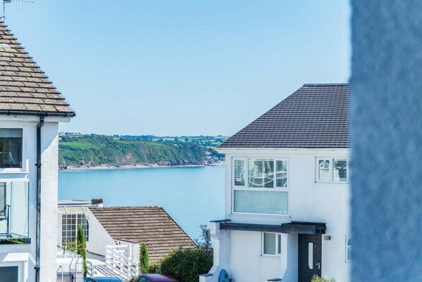 A coastal residential area with houses overlooking a body of water.