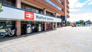 A modern building with a sign reading "Watford Junction".
