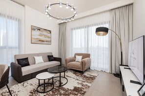 Premium Apartment, 1 Bedroom, Balcony, City View | Living room | 50-inch Smart TV with digital channels -  Premium Apartments at Executive Residences (Dubai)