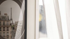 A framed mirror reflecting the Eiffel Tower and Parisian buildings. - Lovely tiny home at Sunnybank CBD Street Parking (Sunnybank)