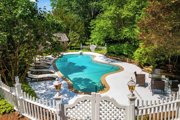 Large private pool with loungers, seating, dining area, fire pit & cabanas