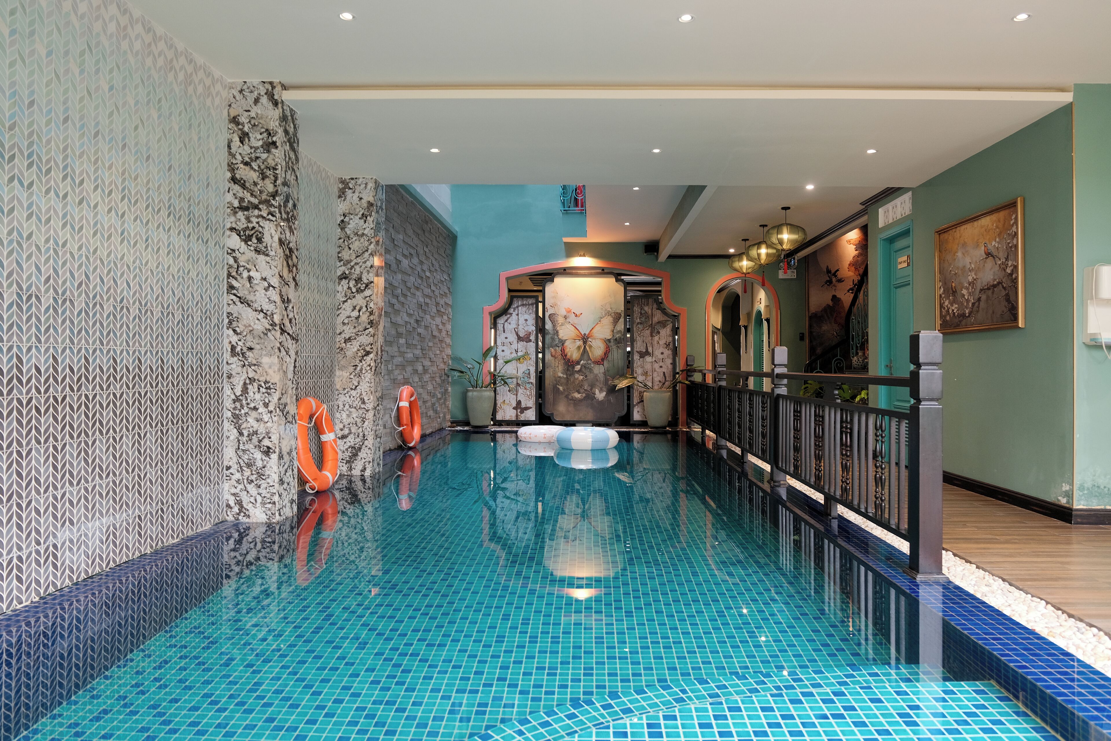 Indoor pool, pool umbrellas, pool loungers