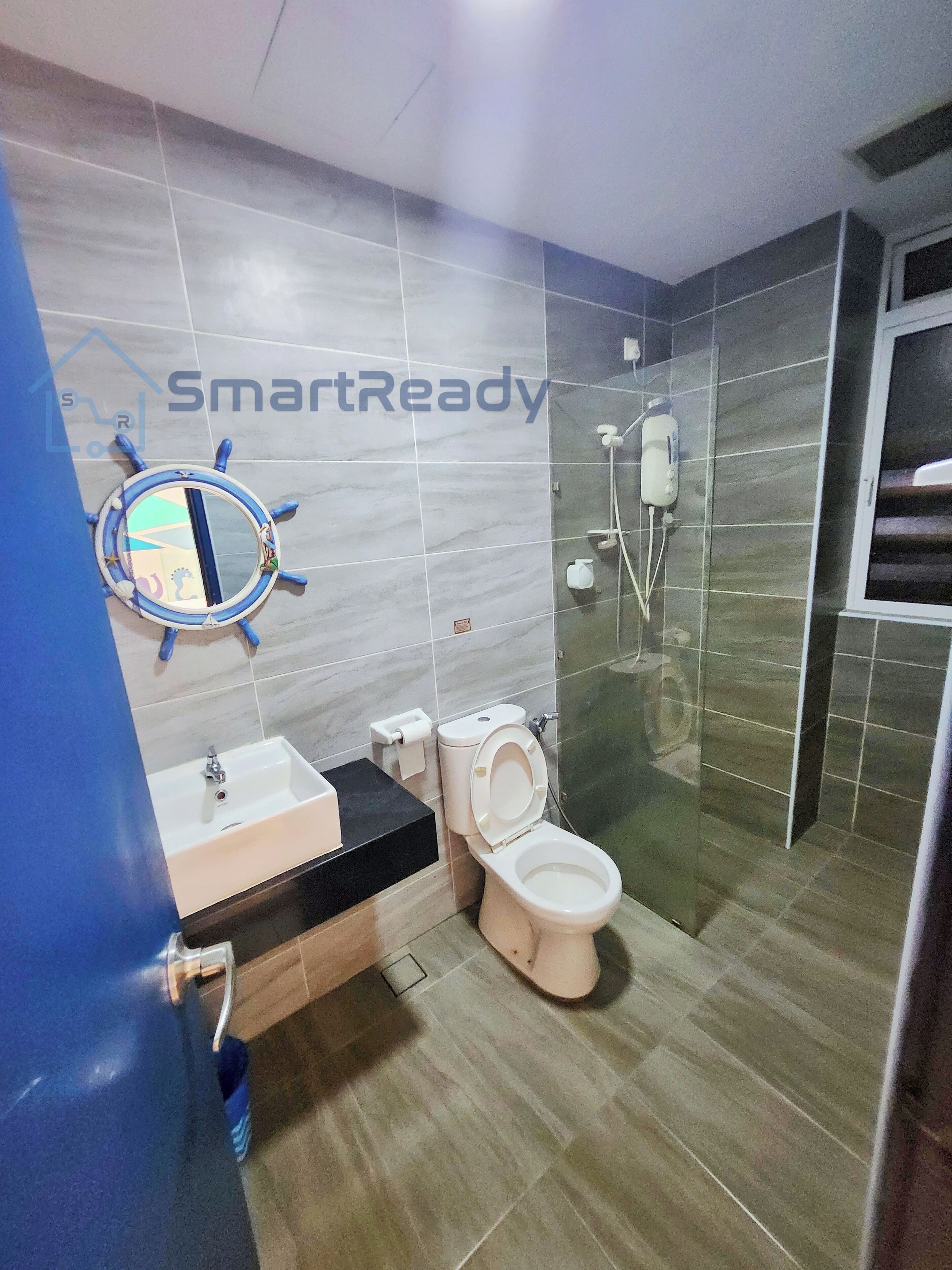 A modern bathroom with a toilet, sink, and shower.