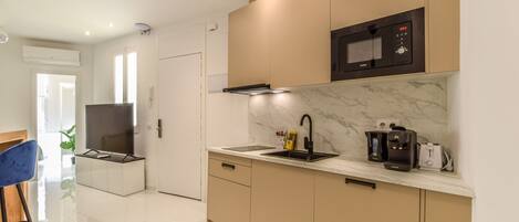 Fridge, microwave, stovetop, coffee/tea maker