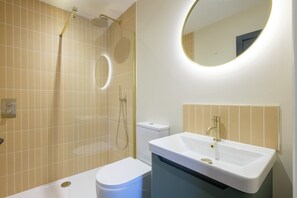Shower, towels, soap, toilet paper