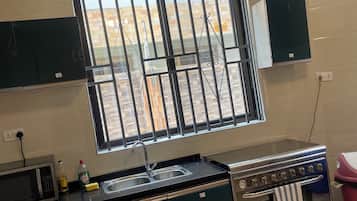 Casa Deluxe, vistas al patio | Cocina privada | Hervidor eléctrico