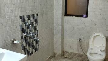 Shower, rainfall showerhead, towels, soap
