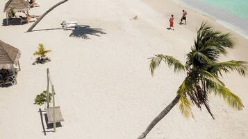 Beach nearby, white sand, sun loungers, beach towels