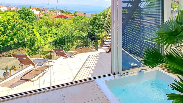 A rooftop pool area with lounge chairs and a view of a cityscape. - Villa With Swimming Pool (Matulji)
