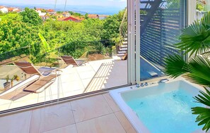 A rooftop pool area with lounge chairs and a view of a cityscape. - Villa With Swimming Pool (Matulji)