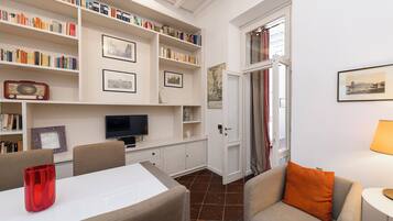 Deluxe Apartment | Living room | 40-inch LED TV with digital channels