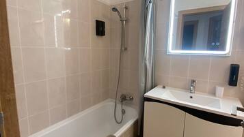 Hair dryer, towels, soap, shampoo