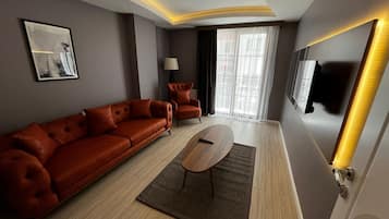 Superior Suite, Non Smoking, City View | Living area | 40-inch LCD TV with satellite channels