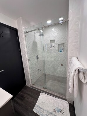 Shower, hair dryer, towels, soap
