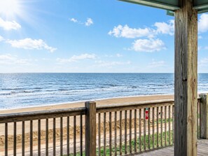 A wooden deck with a view of the ocean and beach. - Beachfront Home | Direct Beach Access | Gulf Views | Large Deck | Pet Friendly (Gilchrist)