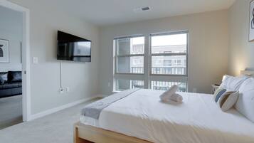 1 bedroom, premium bedding, blackout curtains, iron/ironing board