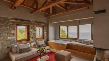 Honeymoon Studio Suite | Living area | TV
