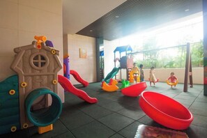 A children's play area with slides and swings. - Aizhihai (Beihai)