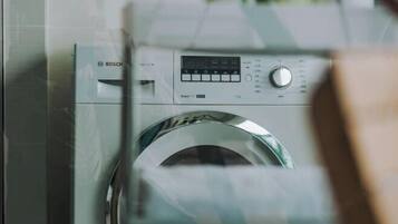 A Bosch washing machine with a digital display and control panel.