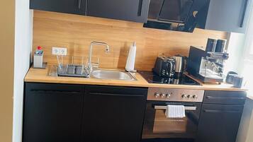 Comfort Apartment | Private kitchen | Full-size fridge, microwave, oven, stovetop